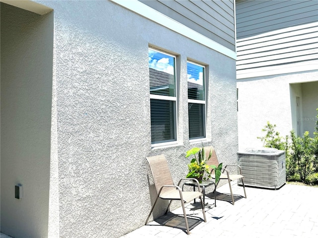 view of patio featuring central AC unit