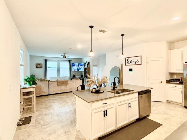 kitchen featuring sink, decorative light fixtures, dishwasher, an island with sink, and white cabinets