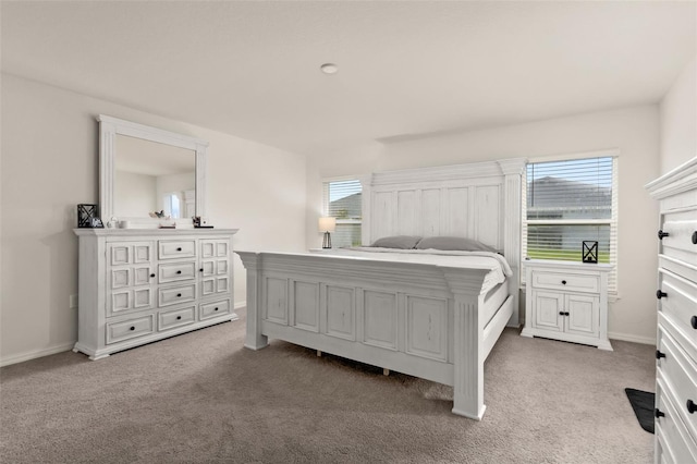 bedroom featuring light colored carpet