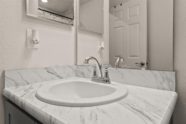 bathroom with vanity and a shower with shower curtain