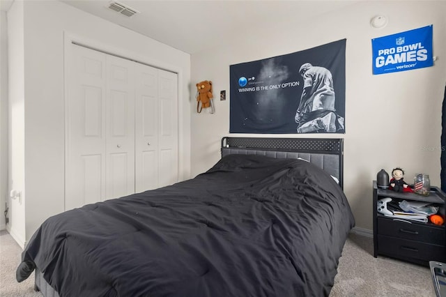 carpeted bedroom featuring a closet