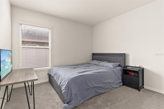 carpeted bedroom featuring multiple windows