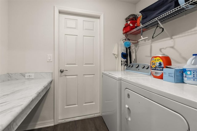 washroom featuring separate washer and dryer and dark hardwood / wood-style floors