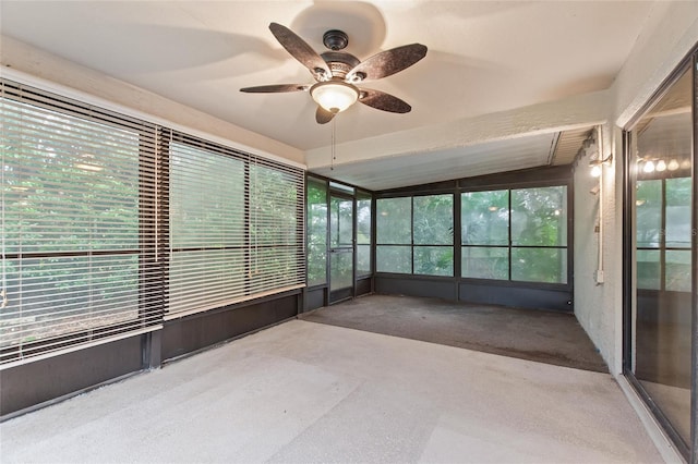 unfurnished sunroom featuring lofted ceiling and ceiling fan