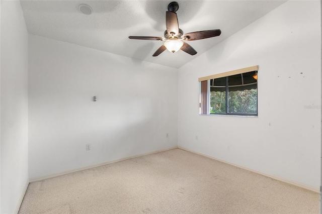 unfurnished room with lofted ceiling, carpet flooring, and ceiling fan