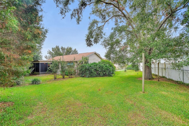 view of yard with a sunroom