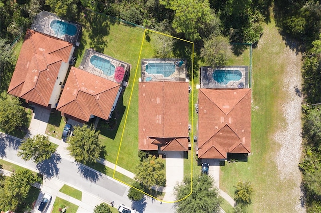 9016 Murano Mews Ct, Kissimmee, FL 34747 - aerial view of property's location featuring a pool area and property parcel outlined