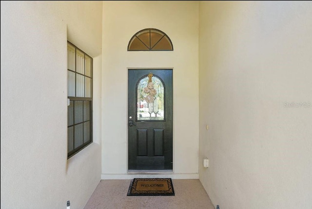 9016 Murano Mews Ct, Kissimmee, FL 34747 - doorway to property with stucco siding