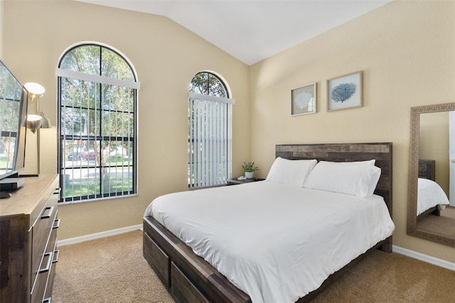 bedroom with light carpet and vaulted ceiling