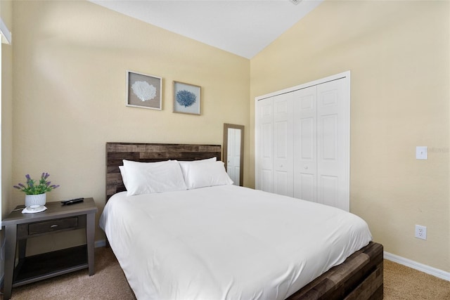 bedroom featuring a closet, lofted ceiling, and carpet floors