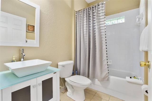 full bathroom with toilet, vanity, shower / bath combo with shower curtain, and tile patterned floors