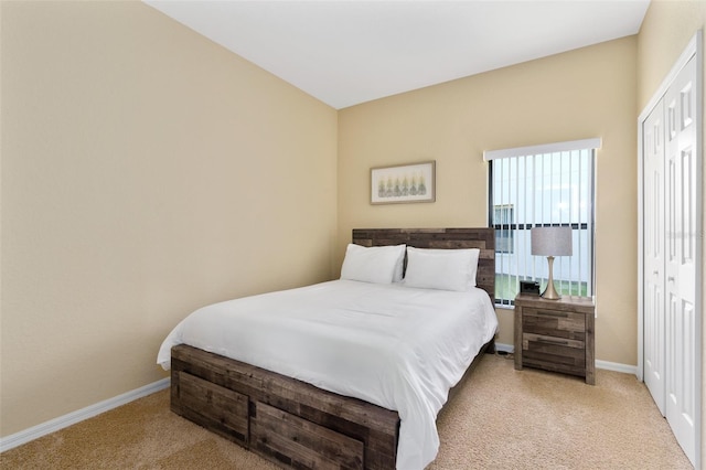 carpeted bedroom with a closet