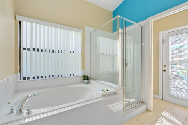 bathroom with tile patterned floors and separate shower and tub