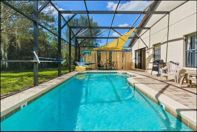 view of swimming pool with glass enclosure, area for grilling, and a patio