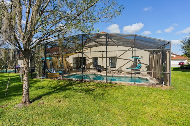 view of pool featuring a yard and a lanai