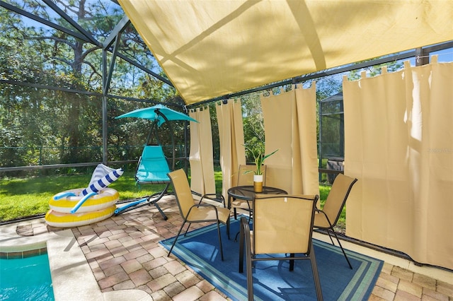 sunroom featuring lofted ceiling