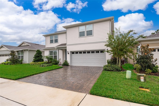 front of property featuring a garage and a front yard