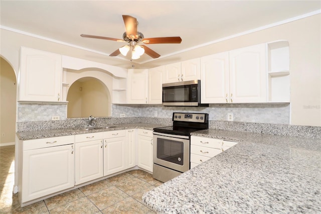 kitchen featuring white cabinets, appliances with stainless steel finishes, ceiling fan, and sink