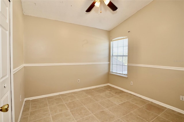 unfurnished room featuring ceiling fan, light tile patterned floors, and lofted ceiling