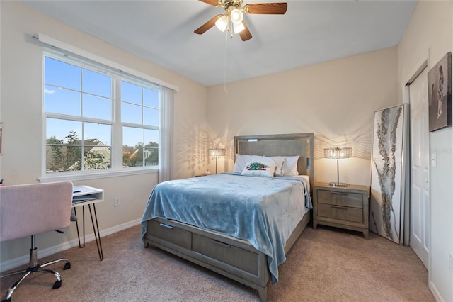 bedroom with light colored carpet and ceiling fan