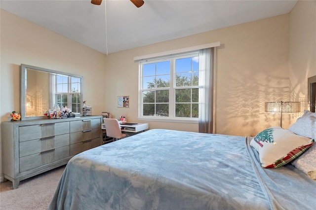 bedroom featuring carpet floors, multiple windows, and ceiling fan