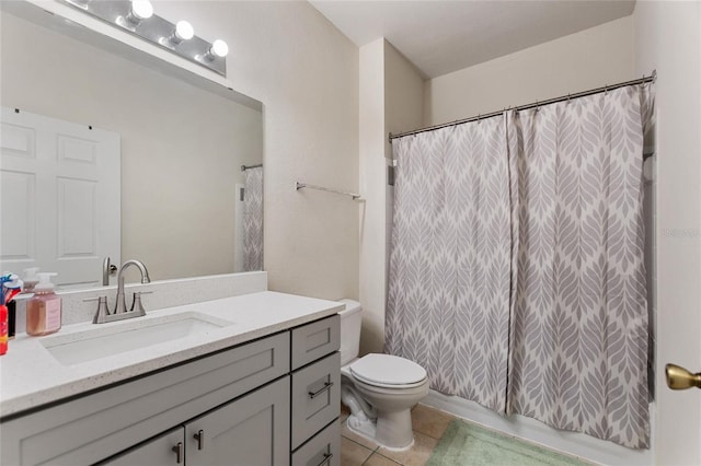 bathroom featuring tile patterned flooring, vanity, toilet, and a shower with curtain