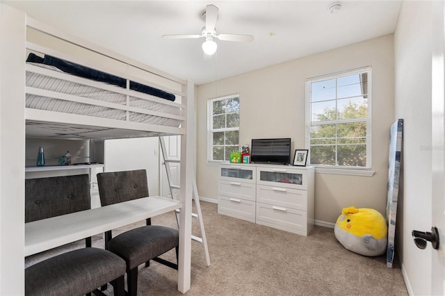 carpeted bedroom with ceiling fan