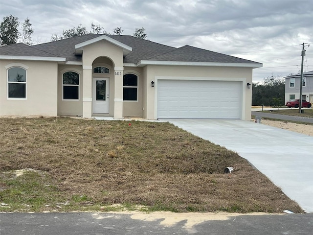 single story home featuring a front yard and a garage