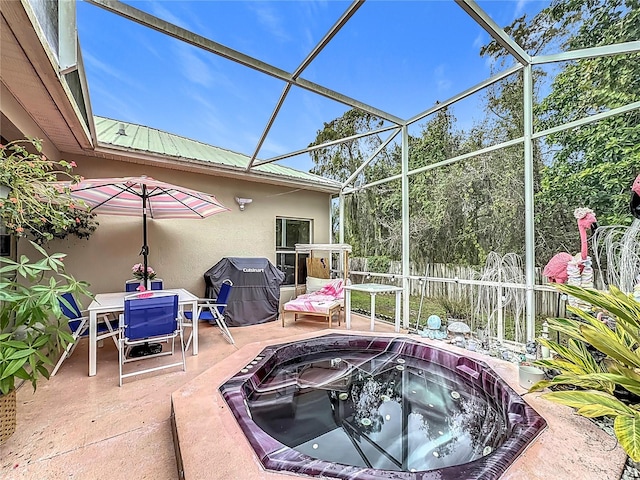 view of patio with a lanai and a grill