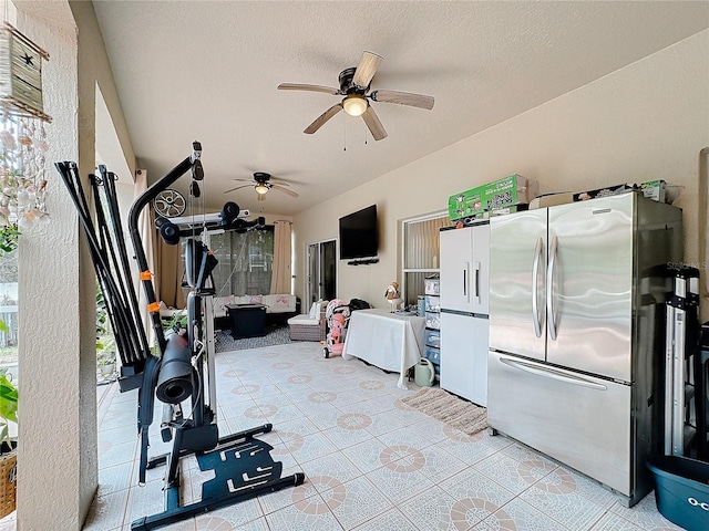 interior space with ceiling fan