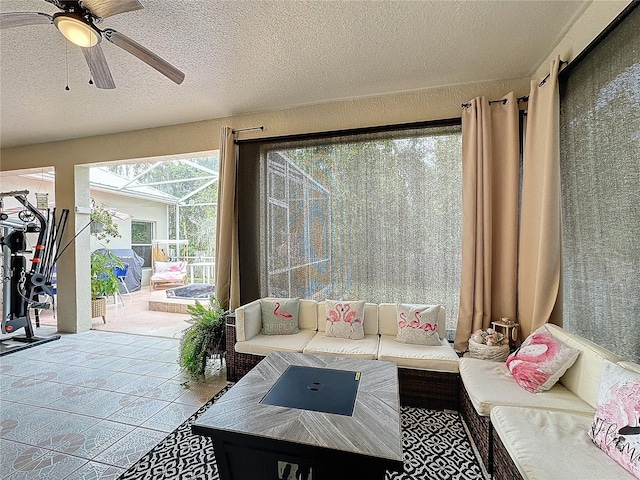 sunroom with ceiling fan