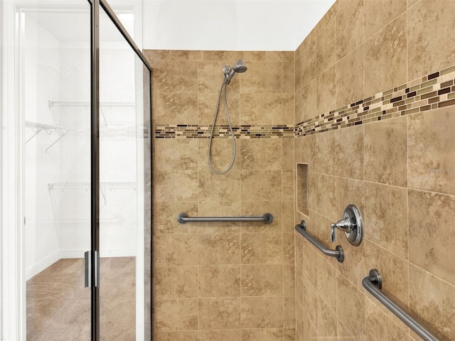 bathroom with a tile shower