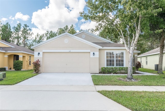 ranch-style home with a garage and a front yard