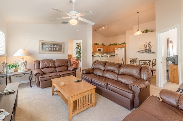 carpeted living room featuring high vaulted ceiling and ceiling fan