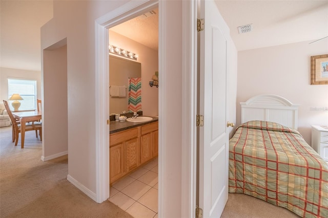 hall featuring light colored carpet and sink