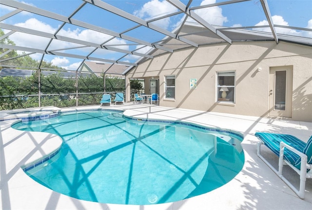 view of pool with a lanai and a patio area