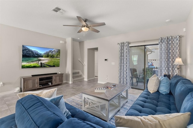 living room featuring light tile patterned floors and ceiling fan