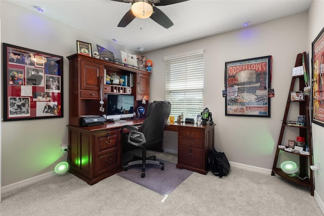 office featuring ceiling fan and light carpet