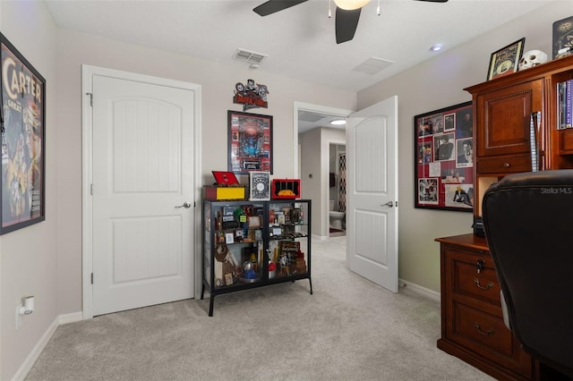 home office with ceiling fan and light colored carpet