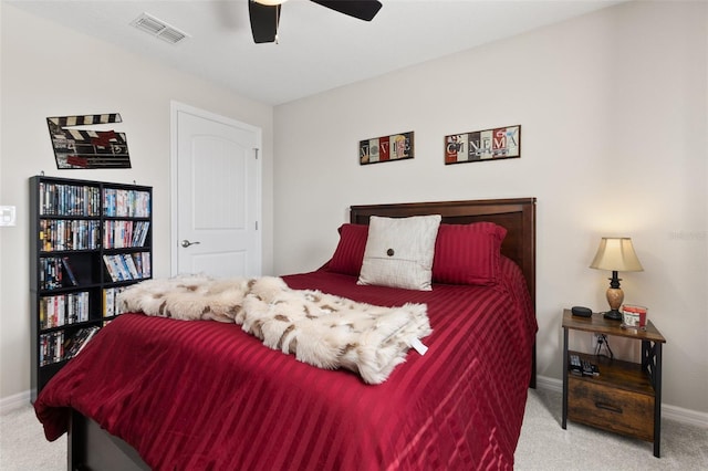 bedroom with ceiling fan and light colored carpet