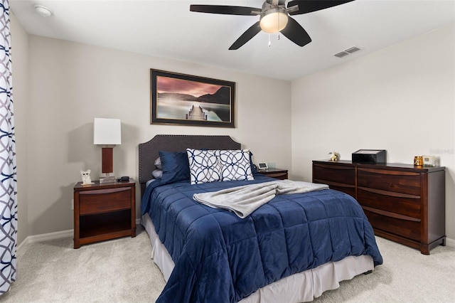 bedroom featuring ceiling fan and light carpet