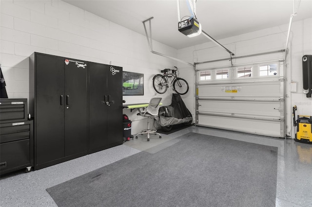 garage featuring a garage door opener