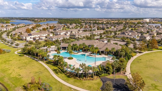 birds eye view of property with a water view