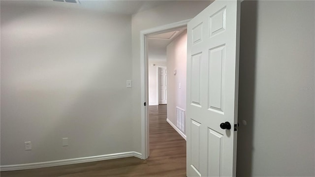 corridor featuring dark hardwood / wood-style floors