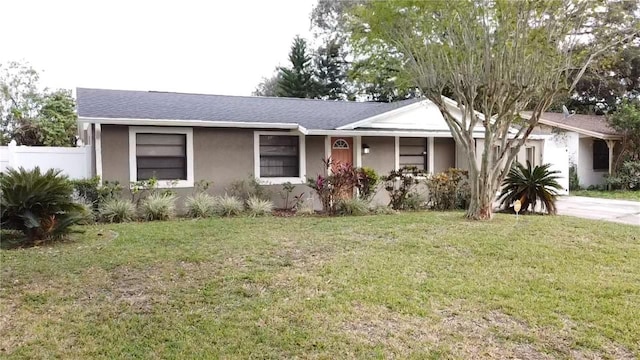 single story home with a front yard