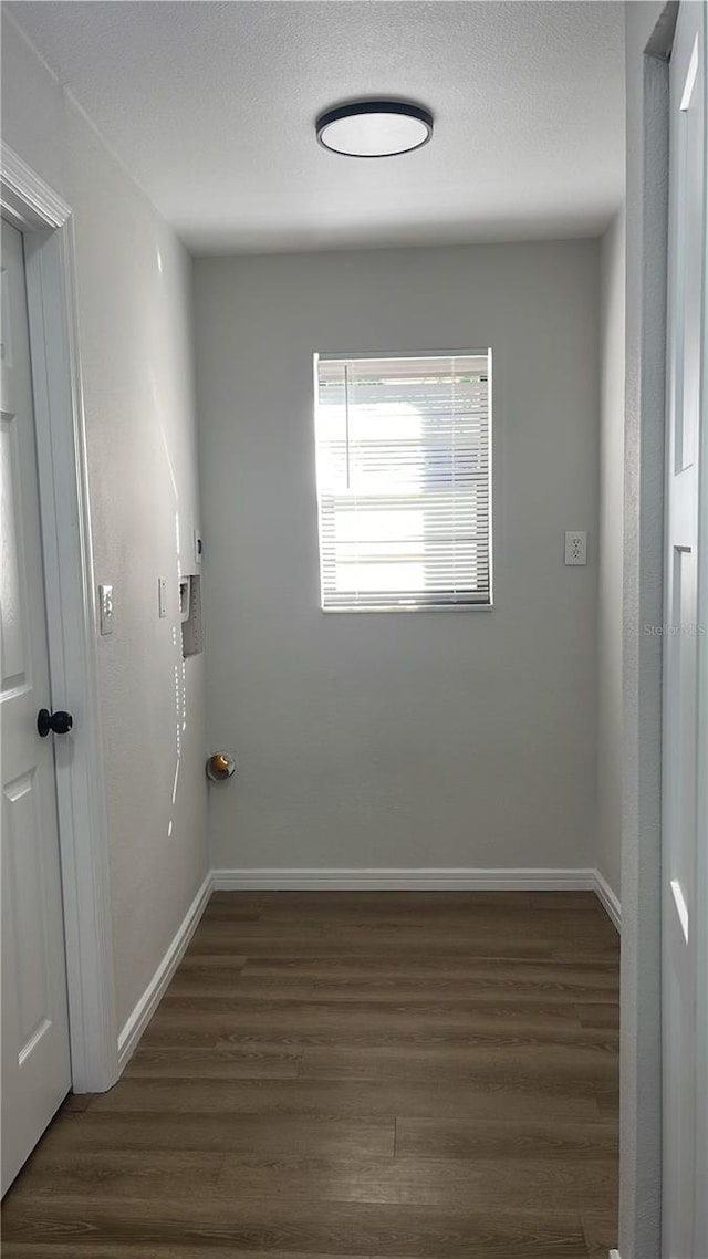 empty room with dark hardwood / wood-style floors