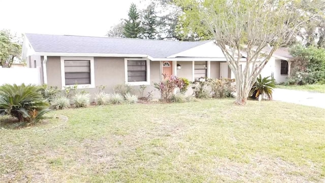 ranch-style house with a front lawn