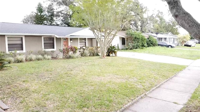 ranch-style home with a front yard