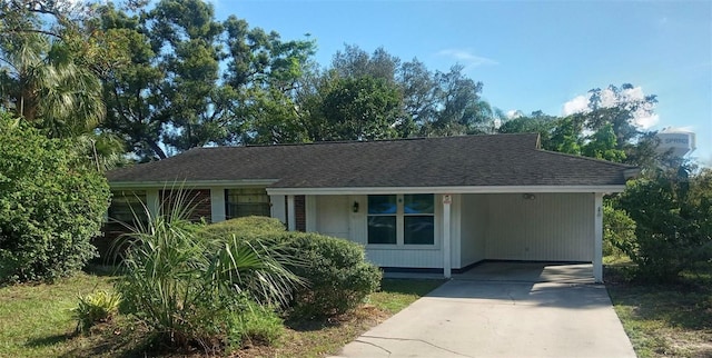 ranch-style house with a carport