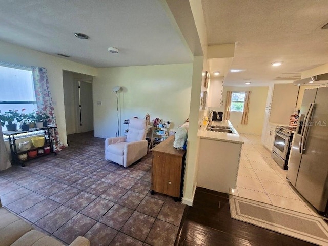 kitchen featuring white cabinets, stainless steel appliances, sink, and dark hardwood / wood-style floors